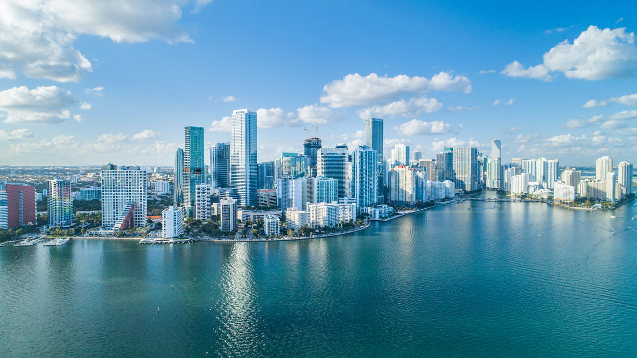 An aerial shot of Brickell Key, with downtown cityscape.